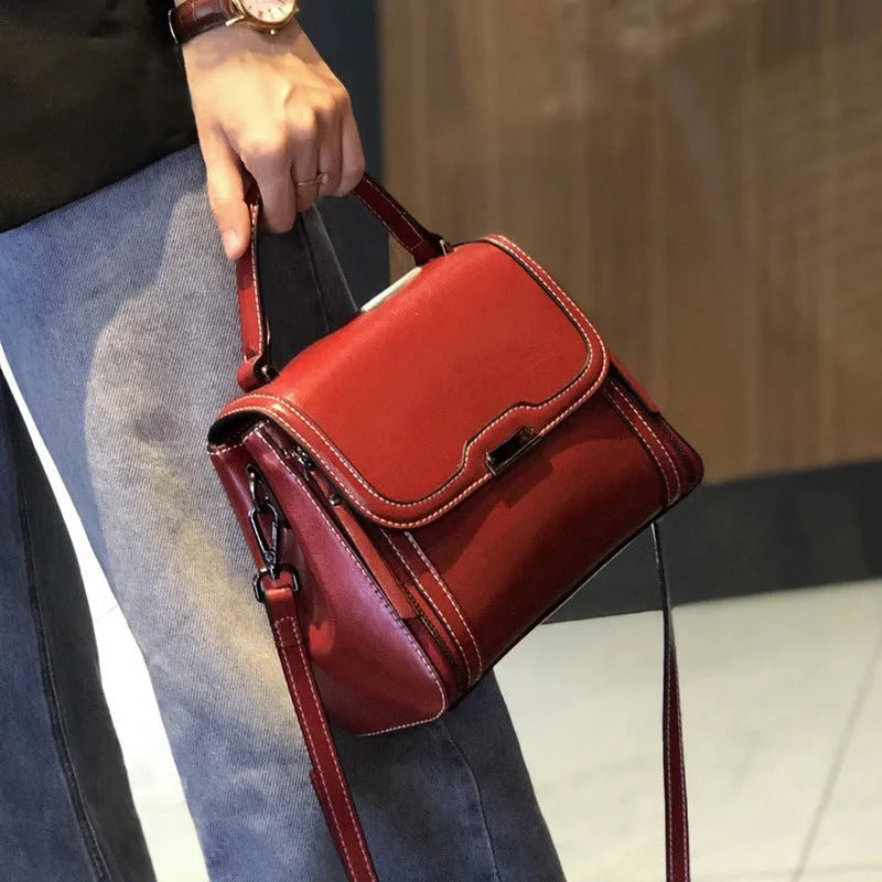 Women's retro style genuine leather messenger bag in horizontal square shape with multiple internal compartments
