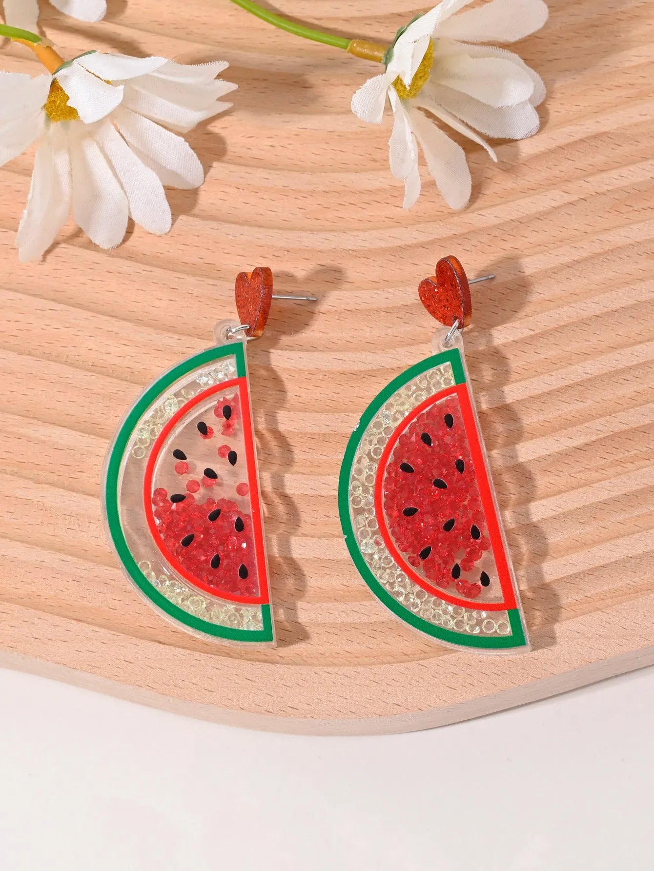 Colourful acrylic earrings with fruit and dessert designs including cherry, strawberry and watermelon shapes
