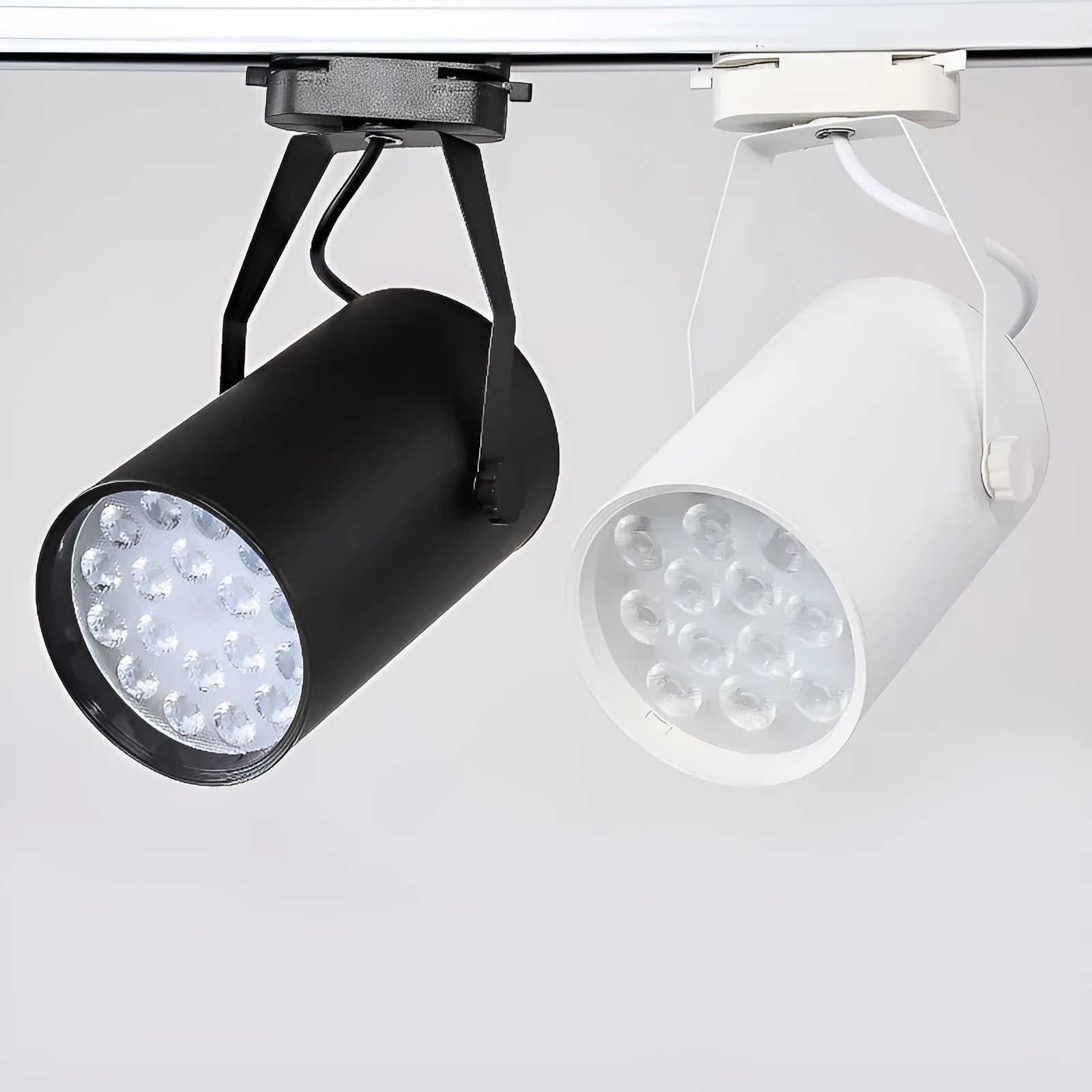 LED track spotlight with open-mounted slide design on black aluminium shell