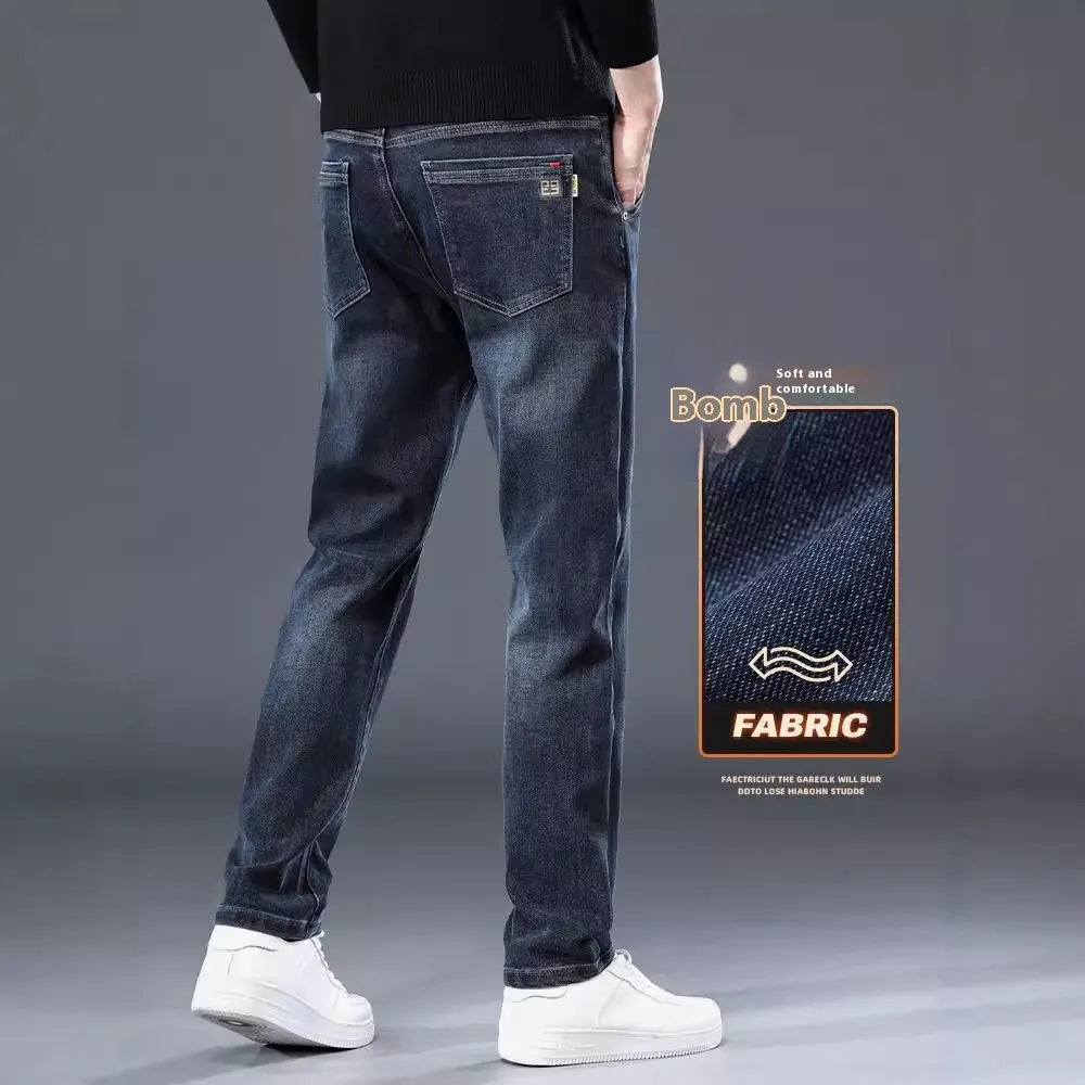 Blue gray slim straight casual men's trousers on a hanger, showing mid-waist fit and zipper fly.