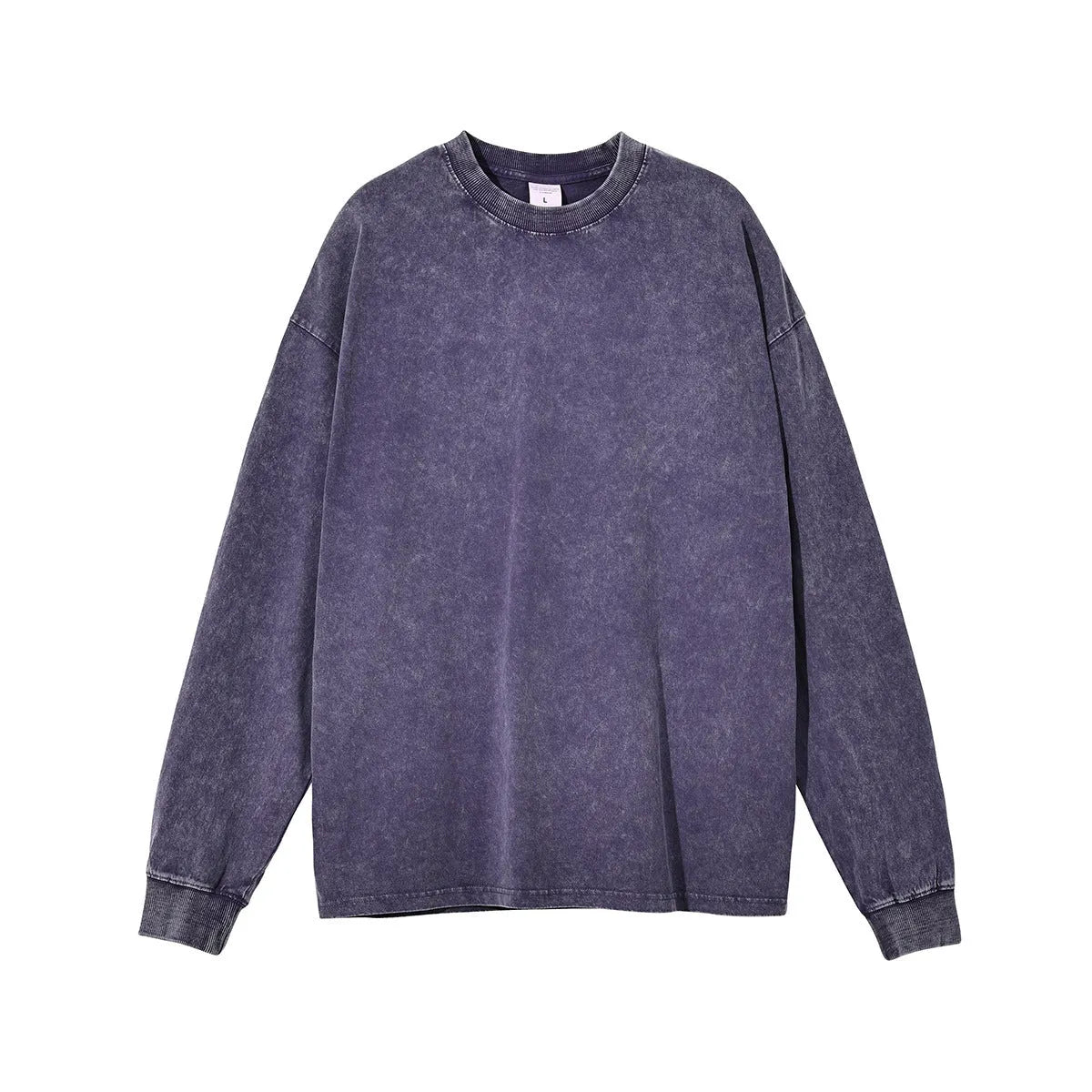 Man wearing a washed vintage style loose long sleeve cotton pullover shirt in a batik colour.
