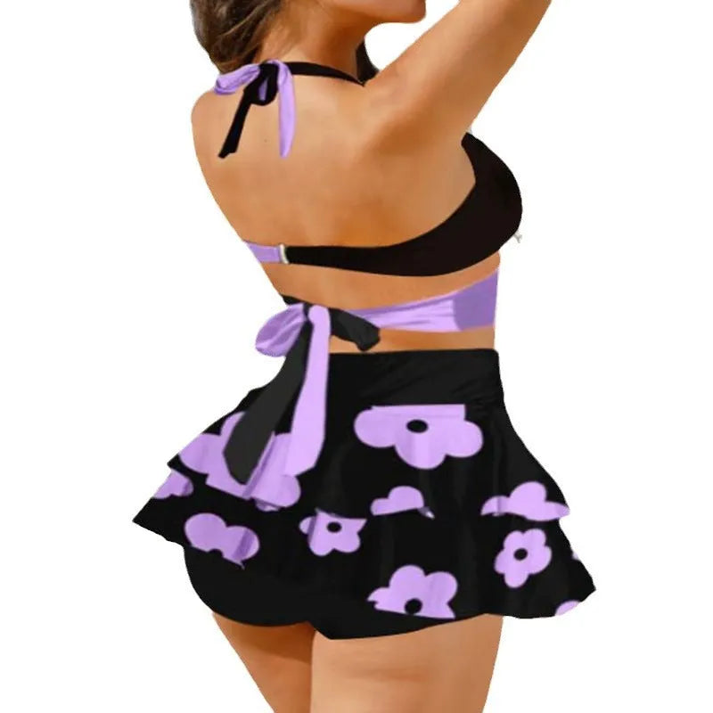 Purple women's high-waist bikini swimsuit with split skirt and lace-up detail