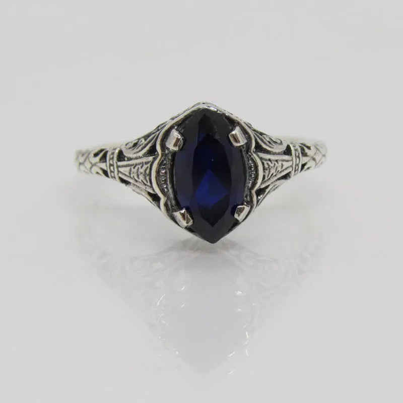 Women's geometric hollow ring in silver electroplated alloy with zircon detail showing open-work pattern
