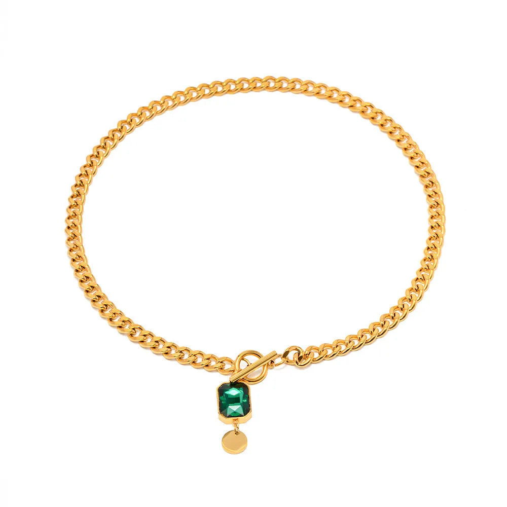 Gold electroplated pendant necklace with geometric round design on Cuban link chain