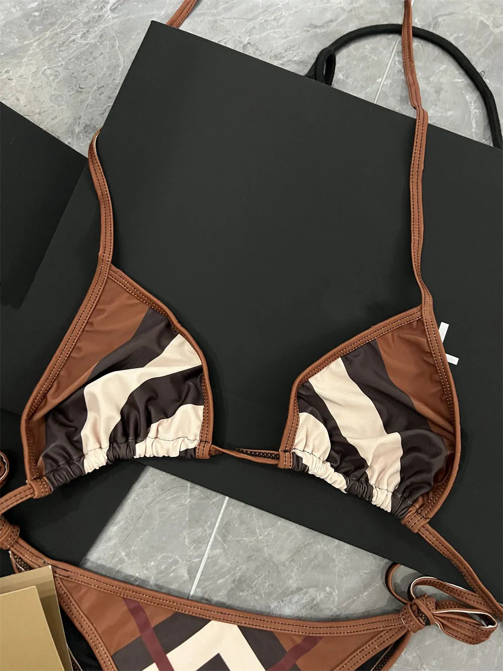 Women's black and white floral bikini set made from polyester fibre, available in sizes S M L XL
