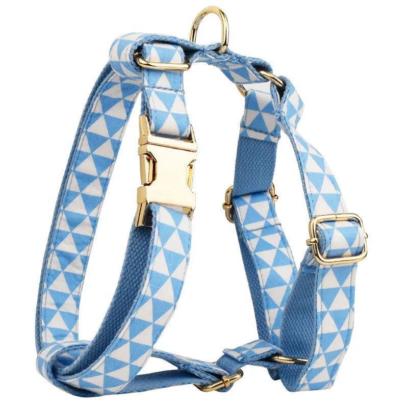 Blue cloth dog vest with triangular rope design, matching collar, leash and bow in a four-piece pet accessory set