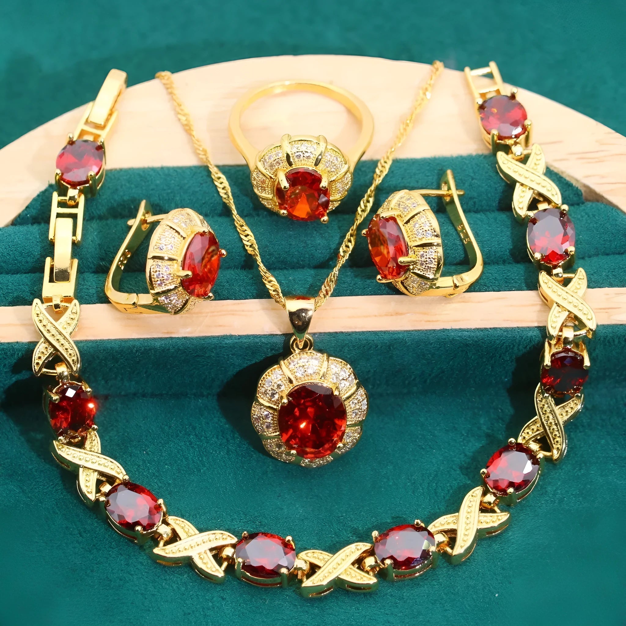 Gold-coloured jewellery set with coloured cubic zirconia stones, showing necklace, earrings, ring, and bracelet.