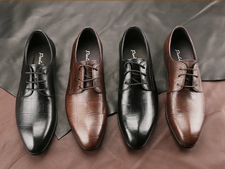 Men's black handcrafted leather derby shoes with a pointed toe and rubber sole.