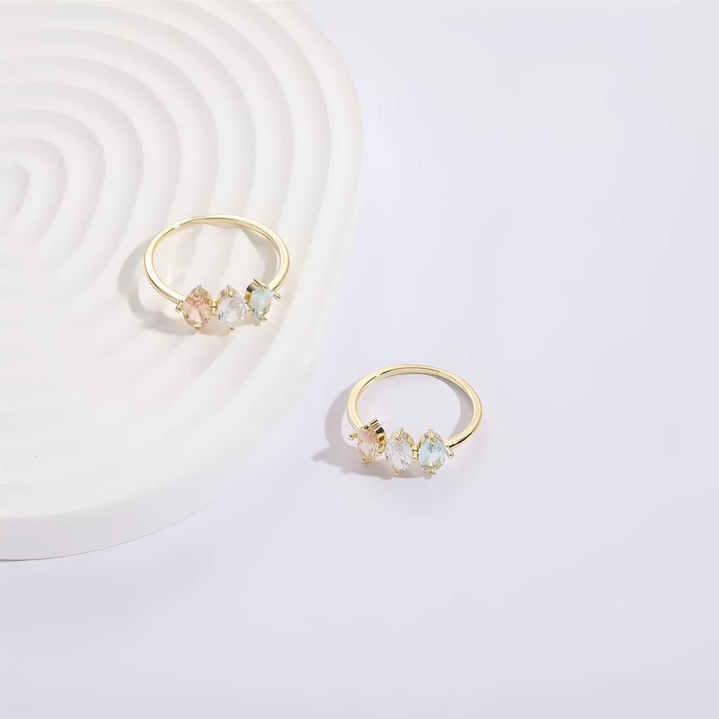 Geometric triangle ring with horse eye design and tricolour zircon stones in gold electroplated finish