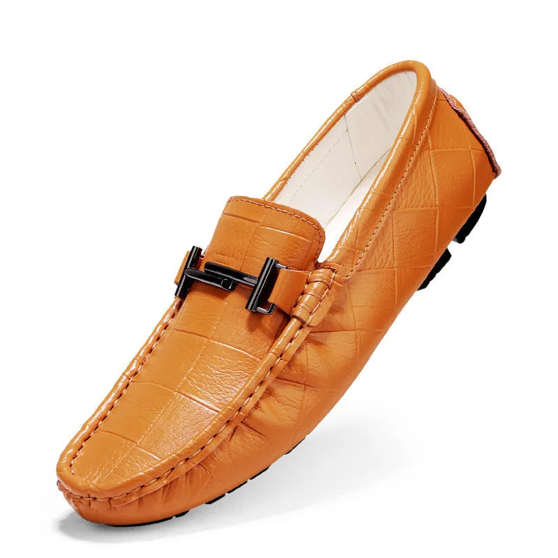 Men's low-cut leather casual shoe with a silver buckle fastener on a flat rubber sole.