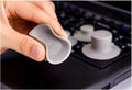 Set of four grey durable plastic laptop cooling pads: two large and two small, on a desk.