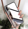 Black iPhone case with a built-in mirror on the back, compatible with iPhone X and iPhone 7 Plus models.