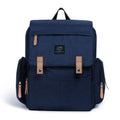 LAND Mommy large grey diaper backpack with multiple compartments and a changing mat laid out