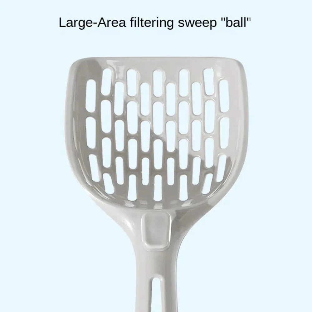Grey plastic cat litter scoop with attached stand, shown next to a litter box.