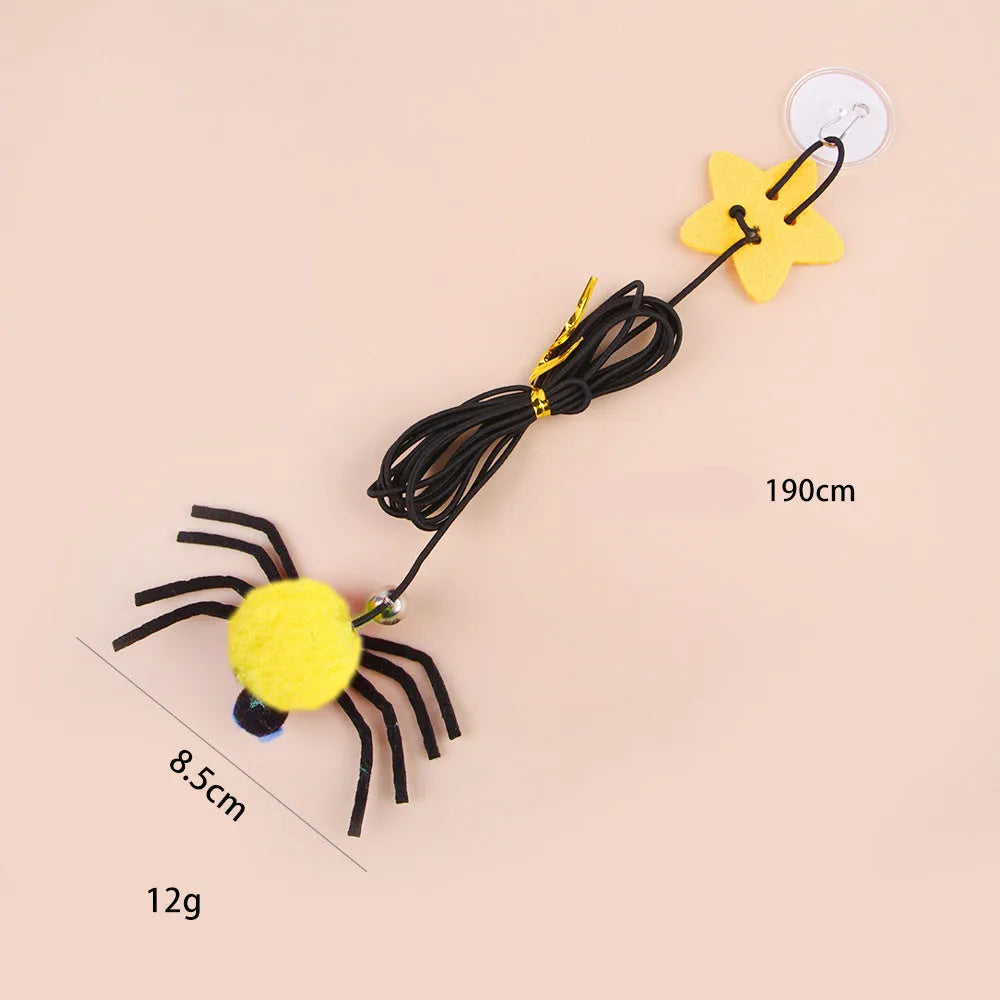Cat hanging door toy with elastic rope, feather stick, bell, and spider decoration in red or yellow colours
