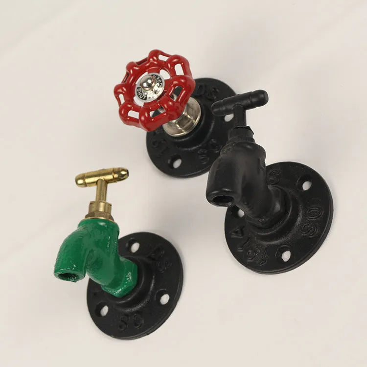 Water pipe style metal towel rack hook mounted on wall with towels hanging