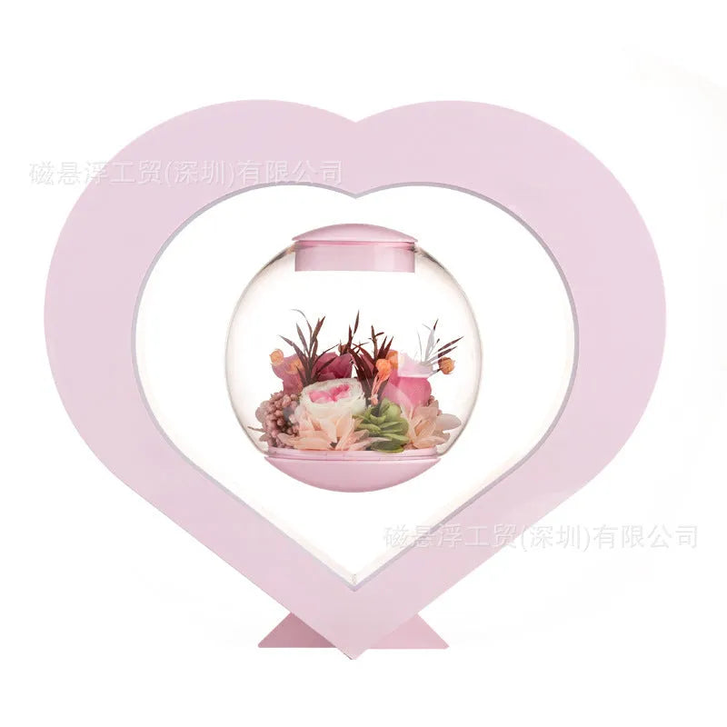 Pink preserved rose decorative ornament with optional Bluetooth-enabled base for playing music