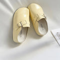 Flat buckle casual sneakers in yellow with round toe design for student commuting wear