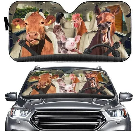 Telescopic aluminium foil car sun visor extended across a vehicle windshield