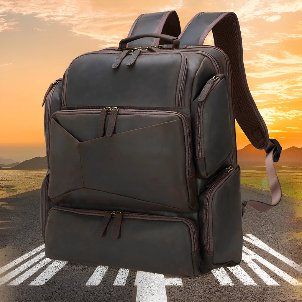 Dark brown Retro Crazy Horse leather backpack for a 17-inch laptop, showing embossed details and double straps.