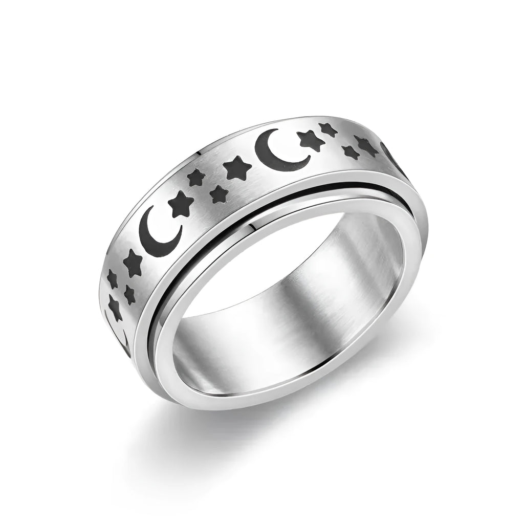 Stars And Moon geometric stainless steel rotatable ring in black star moon finish on a plain background