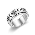 Stars And Moon geometric stainless steel rotatable ring in black star moon finish on a plain background