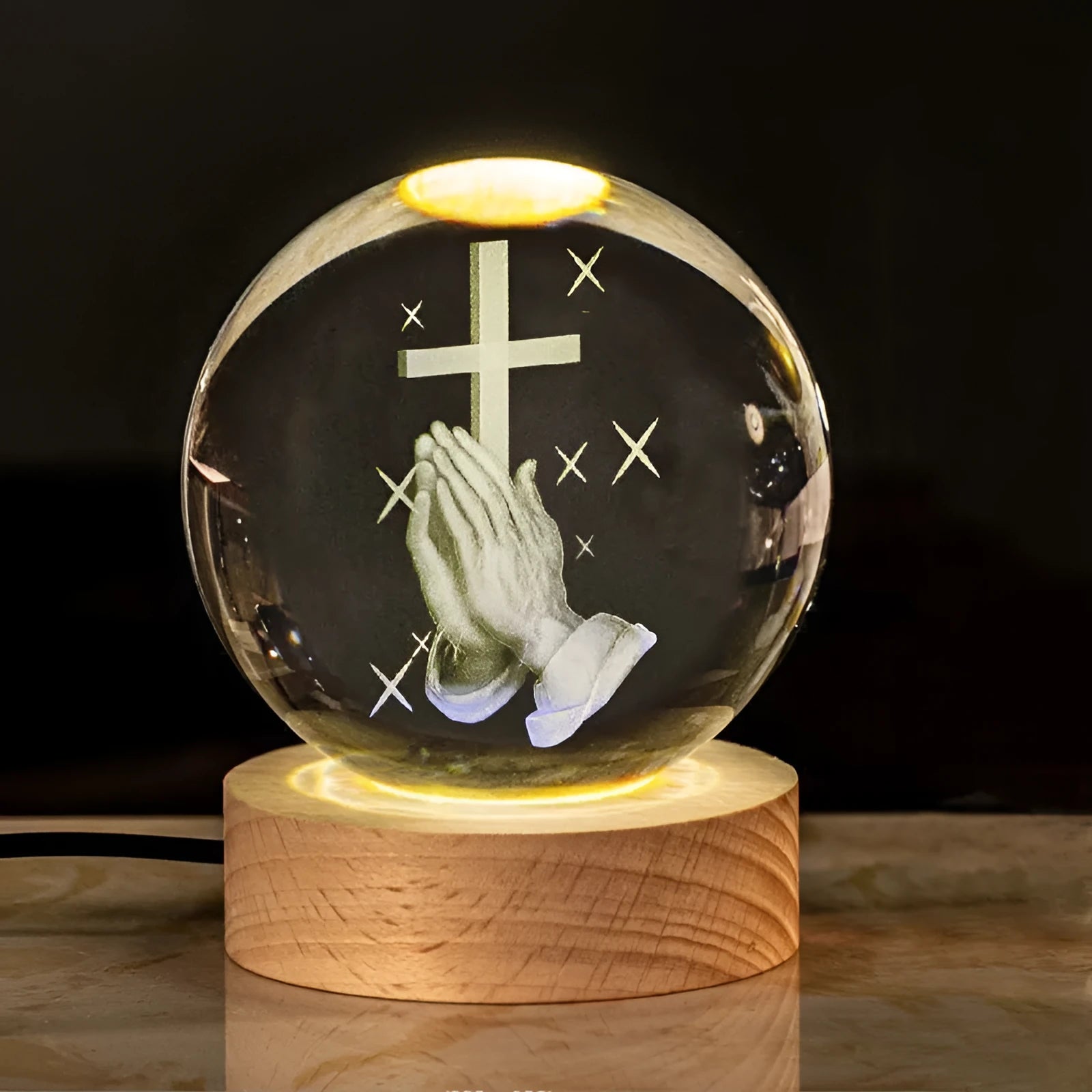 White crystal cross ornament with 6cm ball on wooden warm light base