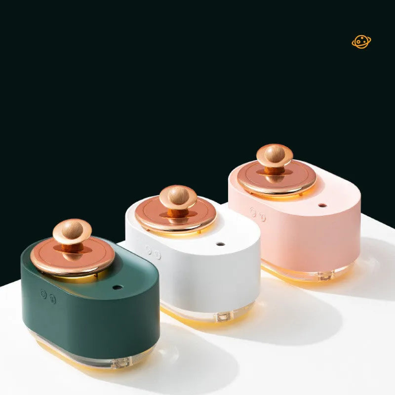 Rotating planet humidifier with USB charging port and night light in green, pink, or white colours