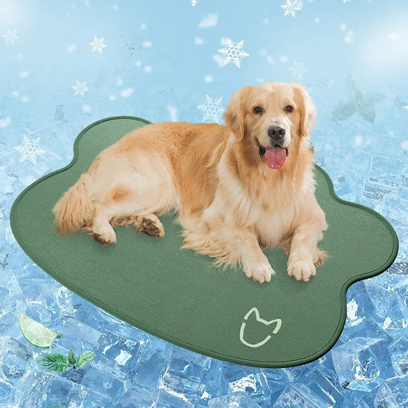 Iced silk pet cooling mat in dark grey with a simple dog head shape, shown on a hardwood floor.