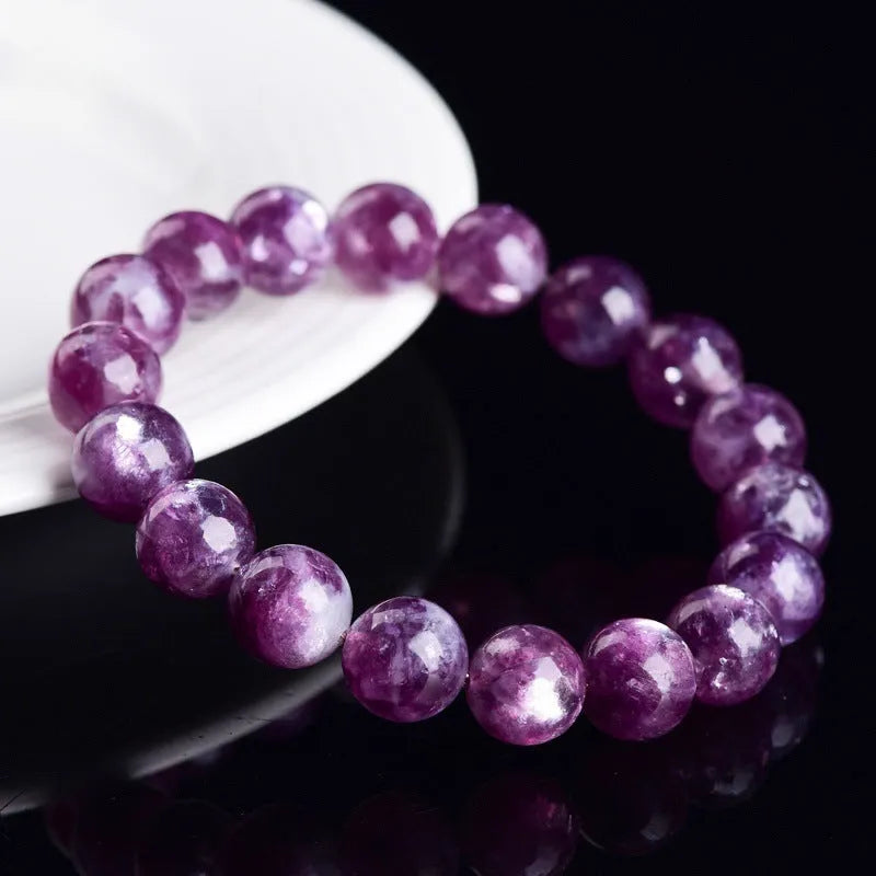 Purple geometric crystal bracelet with polished beads, shown in different size options.