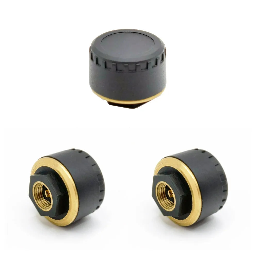 Four black wireless Bluetooth tyre pressure sensors for car monitoring system with mobile phone display