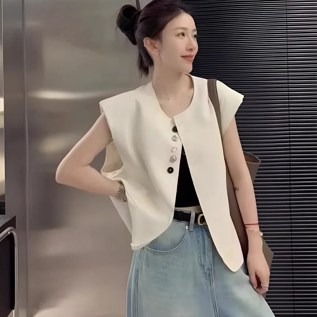 Women's loose-fit short polyester vest in milky white with pocket detail.