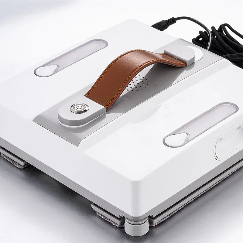White intelligent window cleaning robot with compact design on a window pane