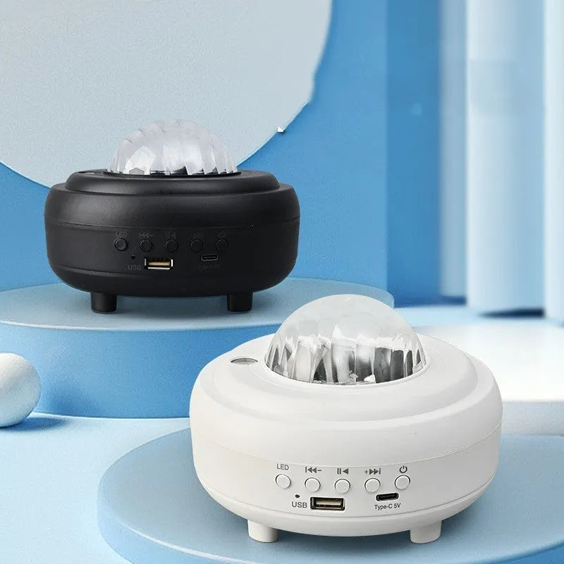 White Galaxy Star Projector Night Light showing star projection on wall next to a smartphone