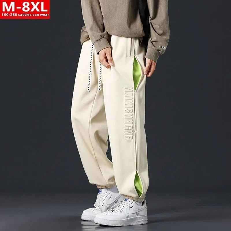 Men's loose fit cotton casual trousers with stitching print design and banded ankle cuffs.