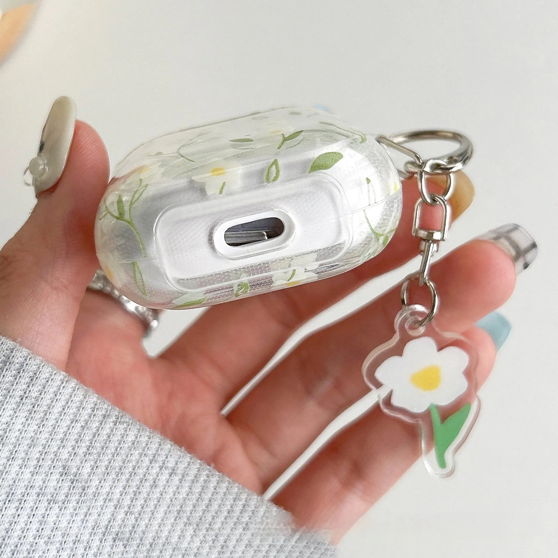 White floral transparent TPU protective case for Apple AirPods showing floral pattern details