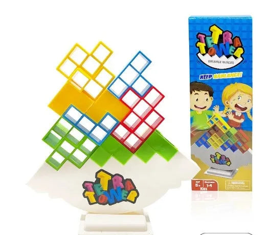 Plastic balance stacking board game with 16 coloured building blocks, chassis, and base on table.