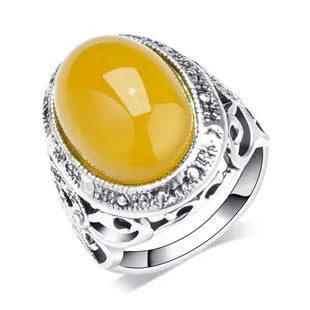 Geometric alloy ring with antique silver and amber electroplated finish shown on a hand.