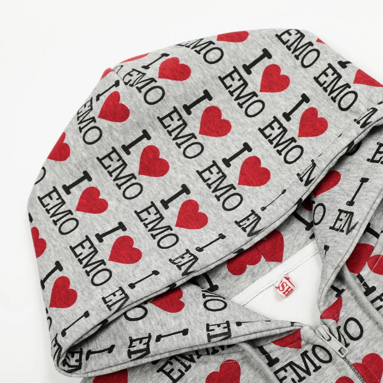 Women's grey hooded cardigan with a colourful autumn-themed retro pattern print on the front.