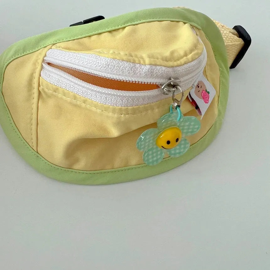 Powder blue backpack-style pet carrier for a small dog, shown with adjustable straps and messenger bag handle.