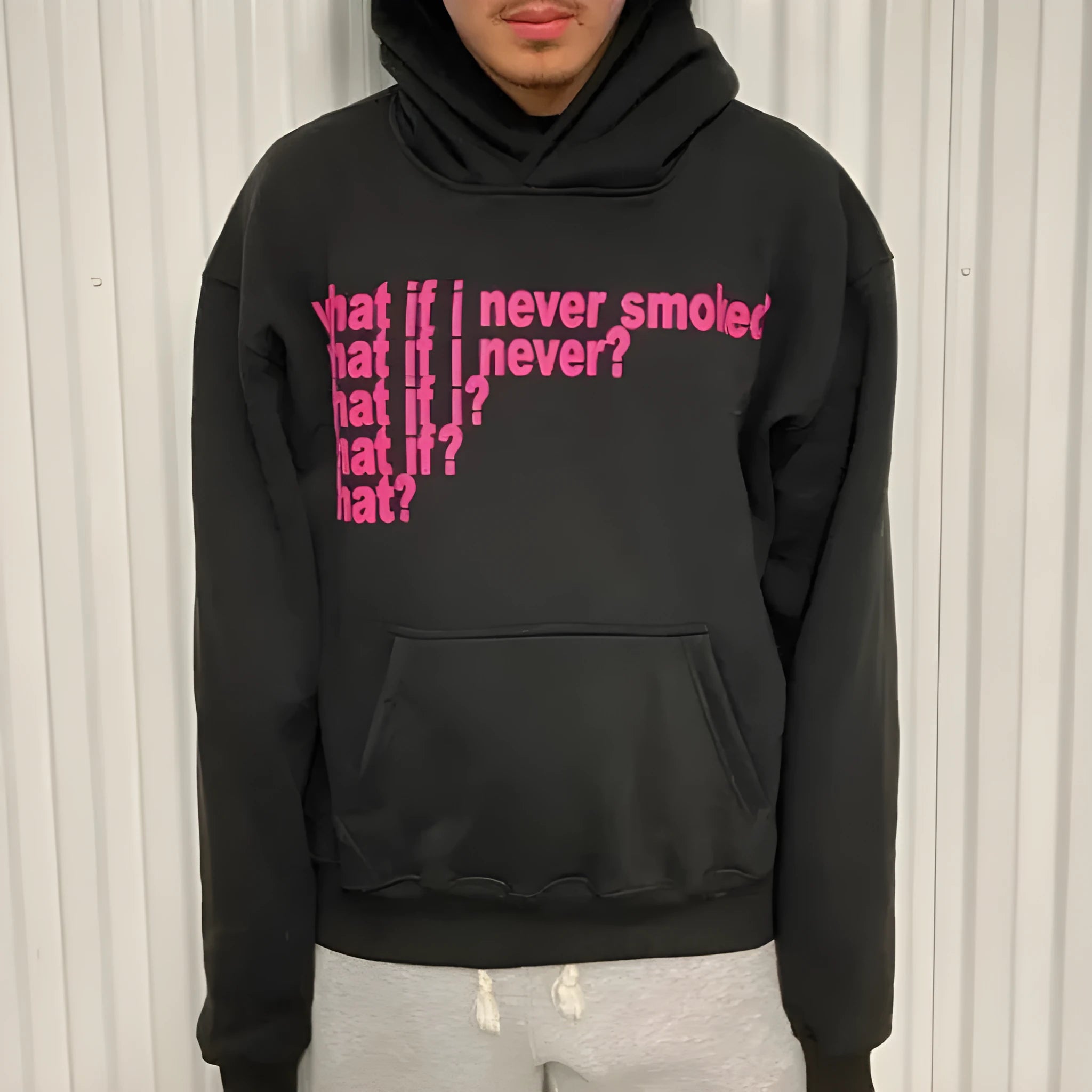 Black hooded sweater with white letter print design, regular sleeves and hooded collar