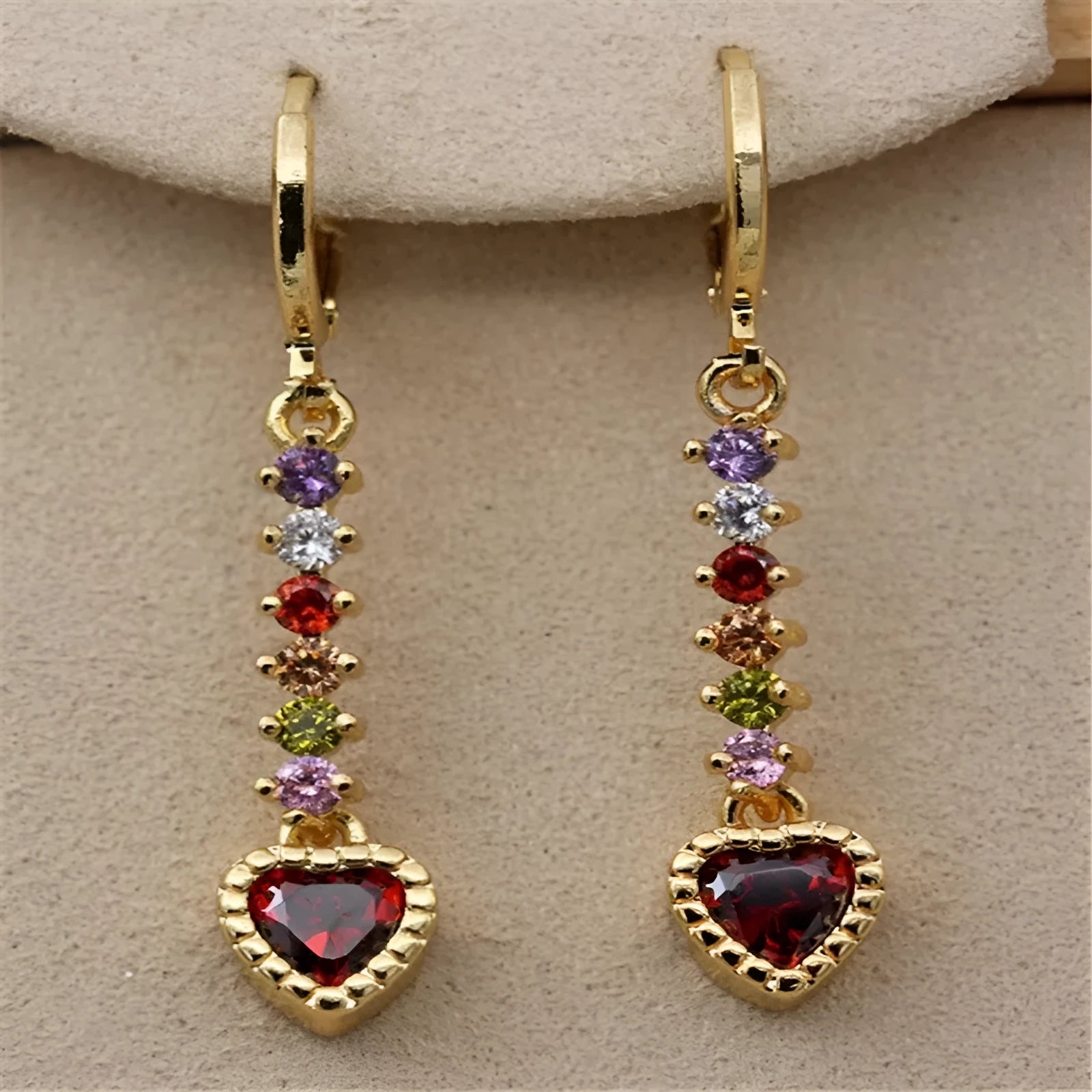 A pair of women's heart-shaped alloy earrings in a gold or silver electroplated colour.