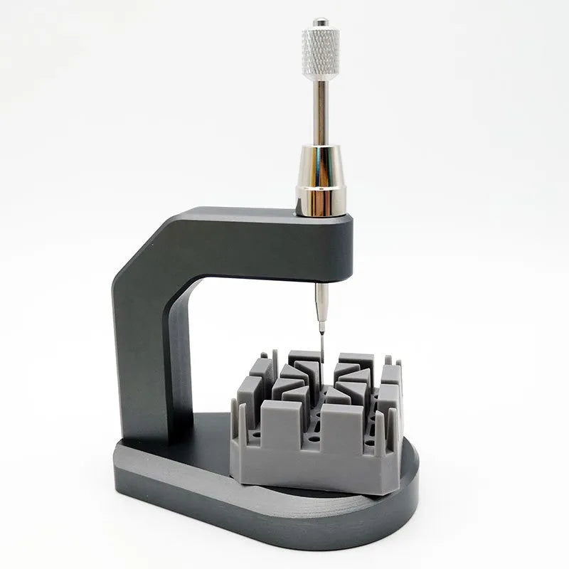 Silver professional press strap removal tool made of tool steel for watch and electronics repair.