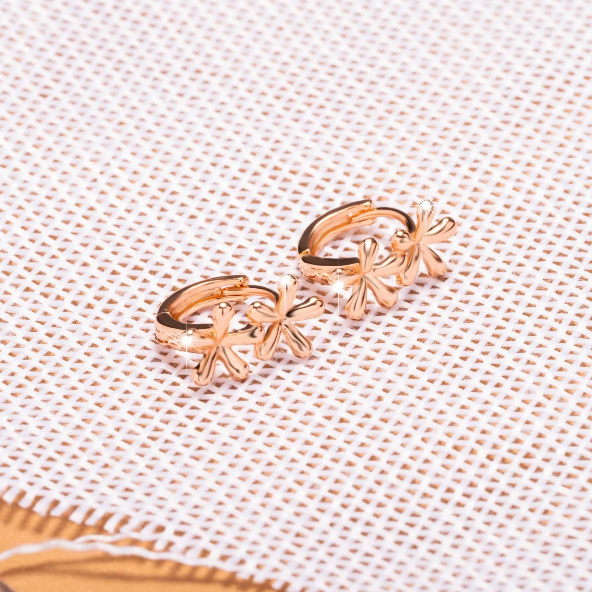 Rose gold waterdrop floral earrings with circular design and electroplated finish