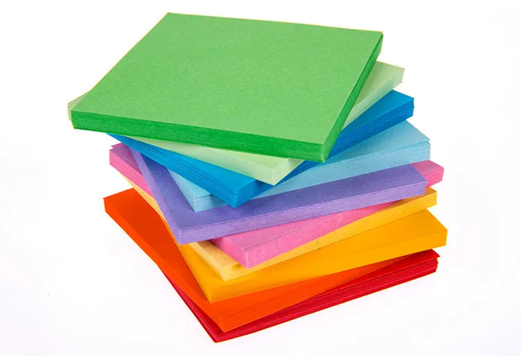 Multi-coloured mini paper scrolls in various sizes with metal eyelets for hanging.