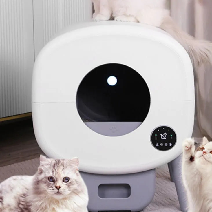 White automatic cat litter box with control panel, waste storage compartment, and cleaning mechanism