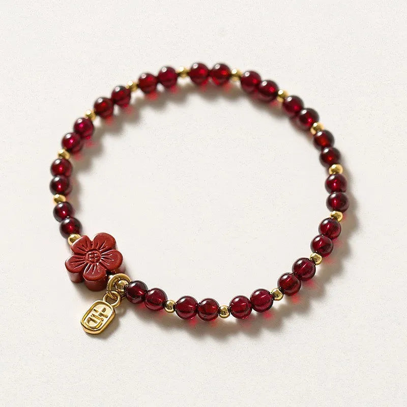Women's freshwater pearl and geometric crystal bracelet on a stretchy elastic rope.