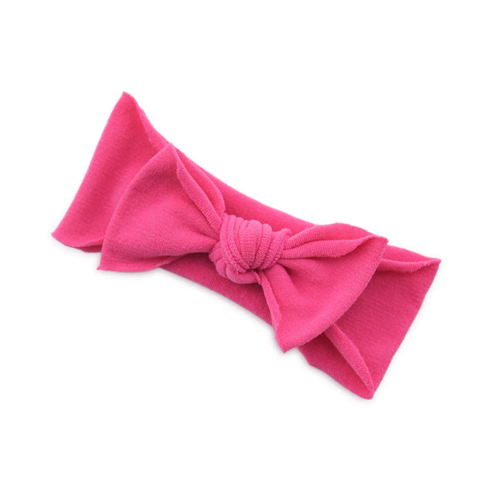 Solid colour knotted cloth headband for baby girls with bowknot design, available in 37 colours