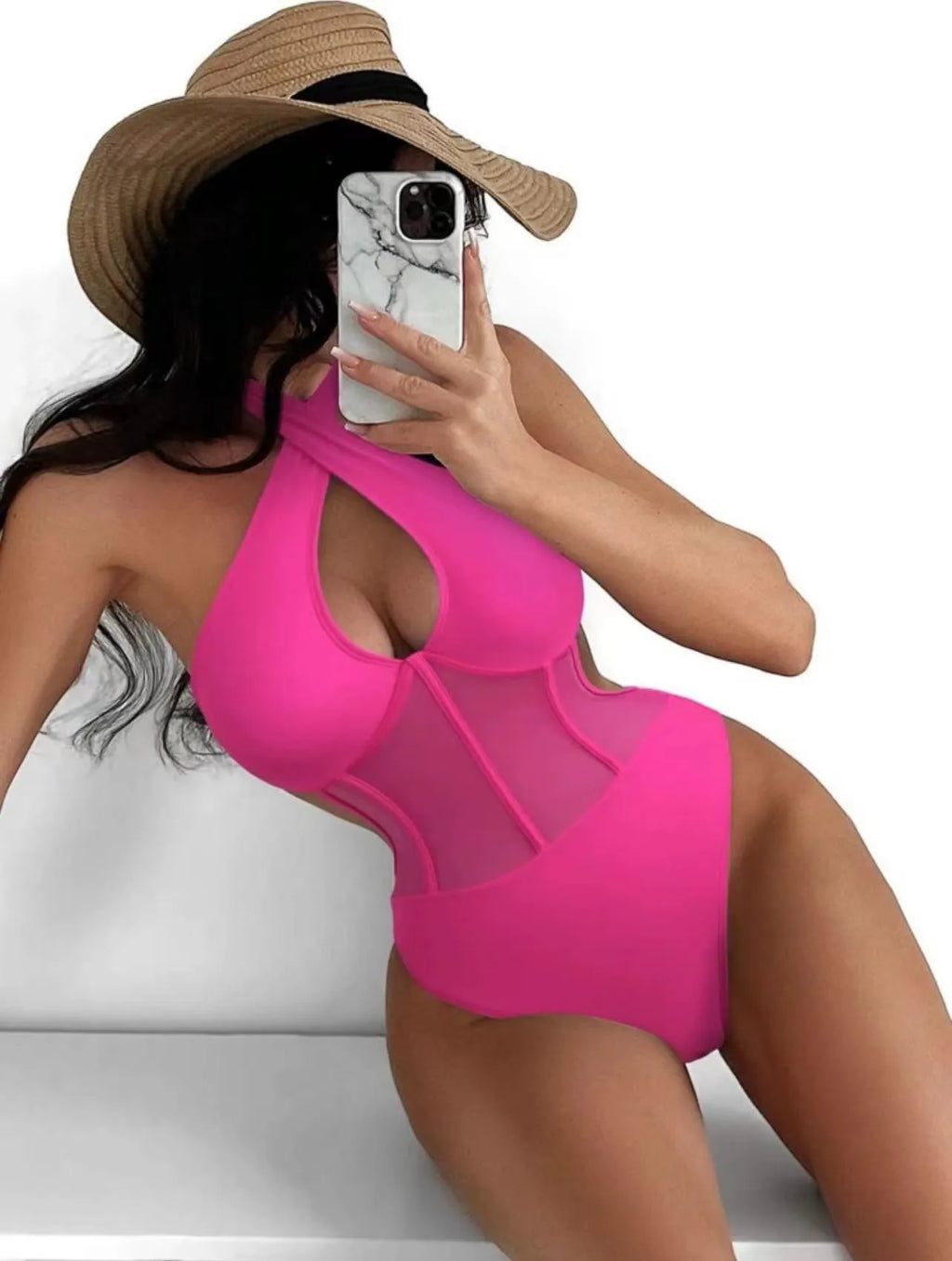 A black ladies one-piece swimsuit bikini made from nylon and spandex fabric on a neutral background.