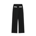 Women's two-piece suit with beaded round-neck top and high-waisted trousers on a hanger.